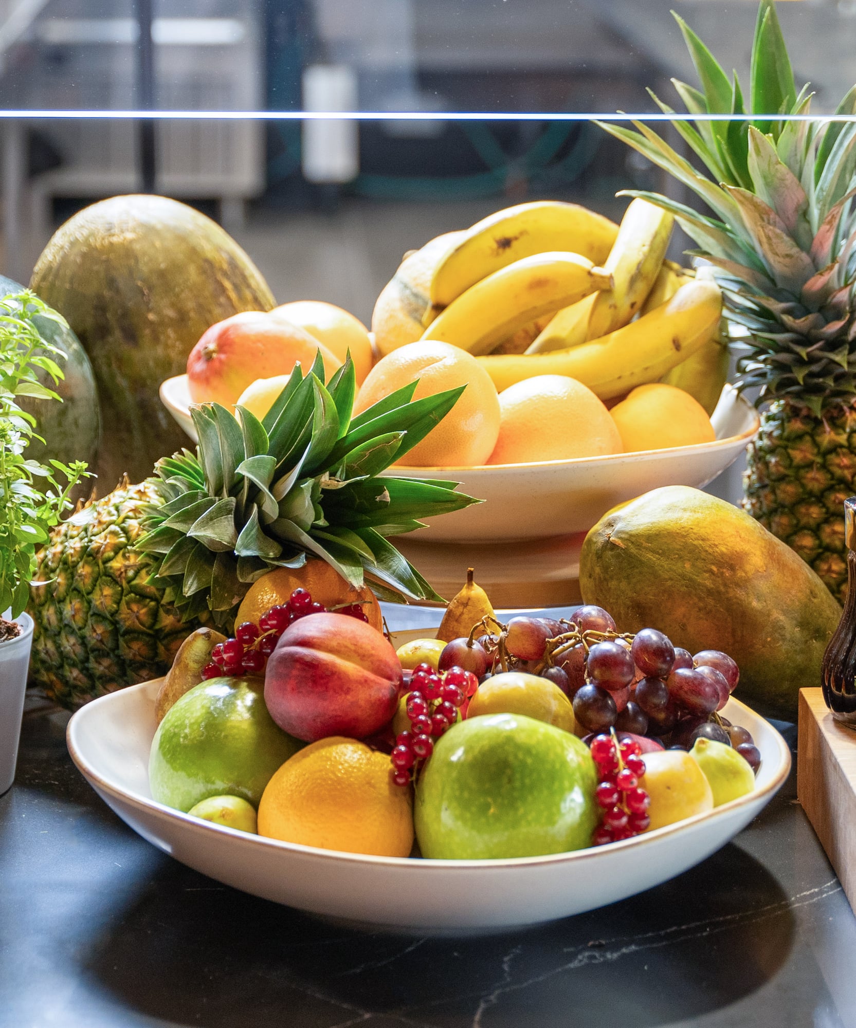 a bowl of fruit on a table