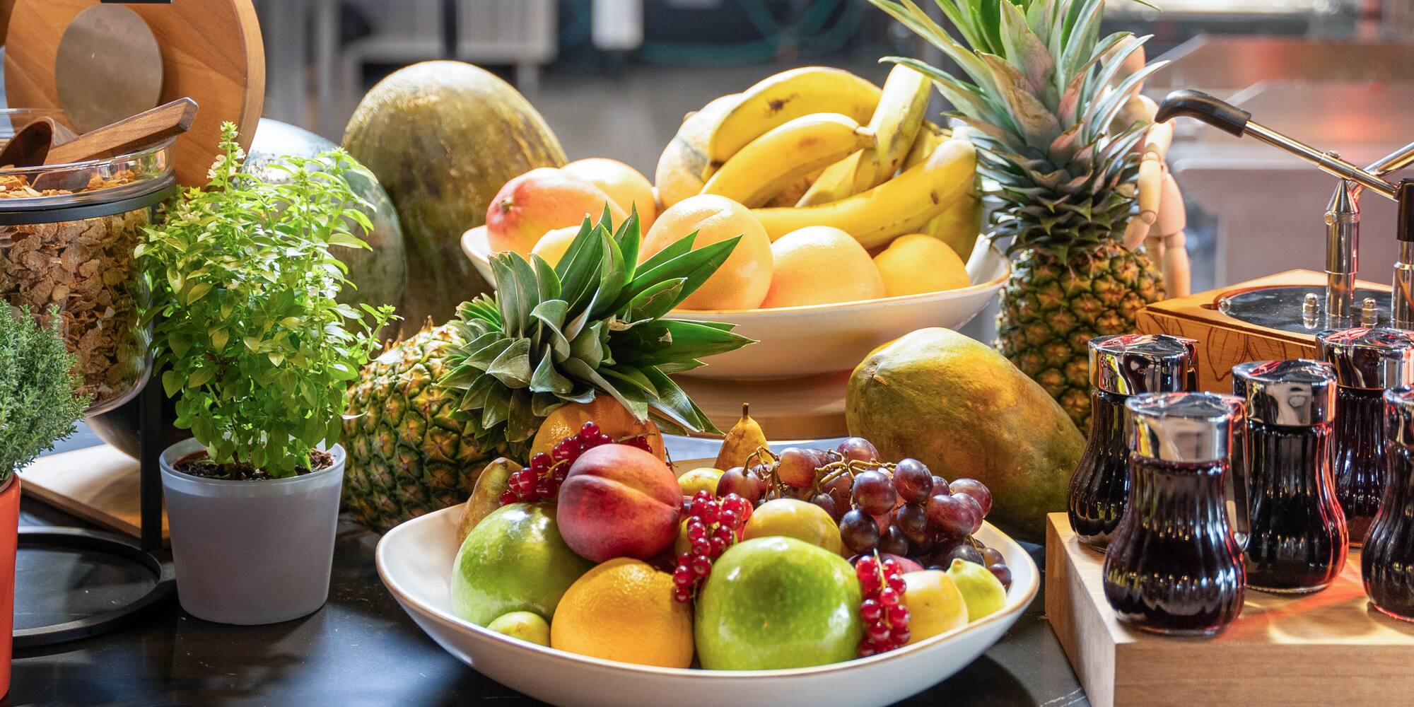 a bowl of fruit on a table