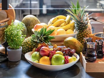 a bowl of fruit on a table
