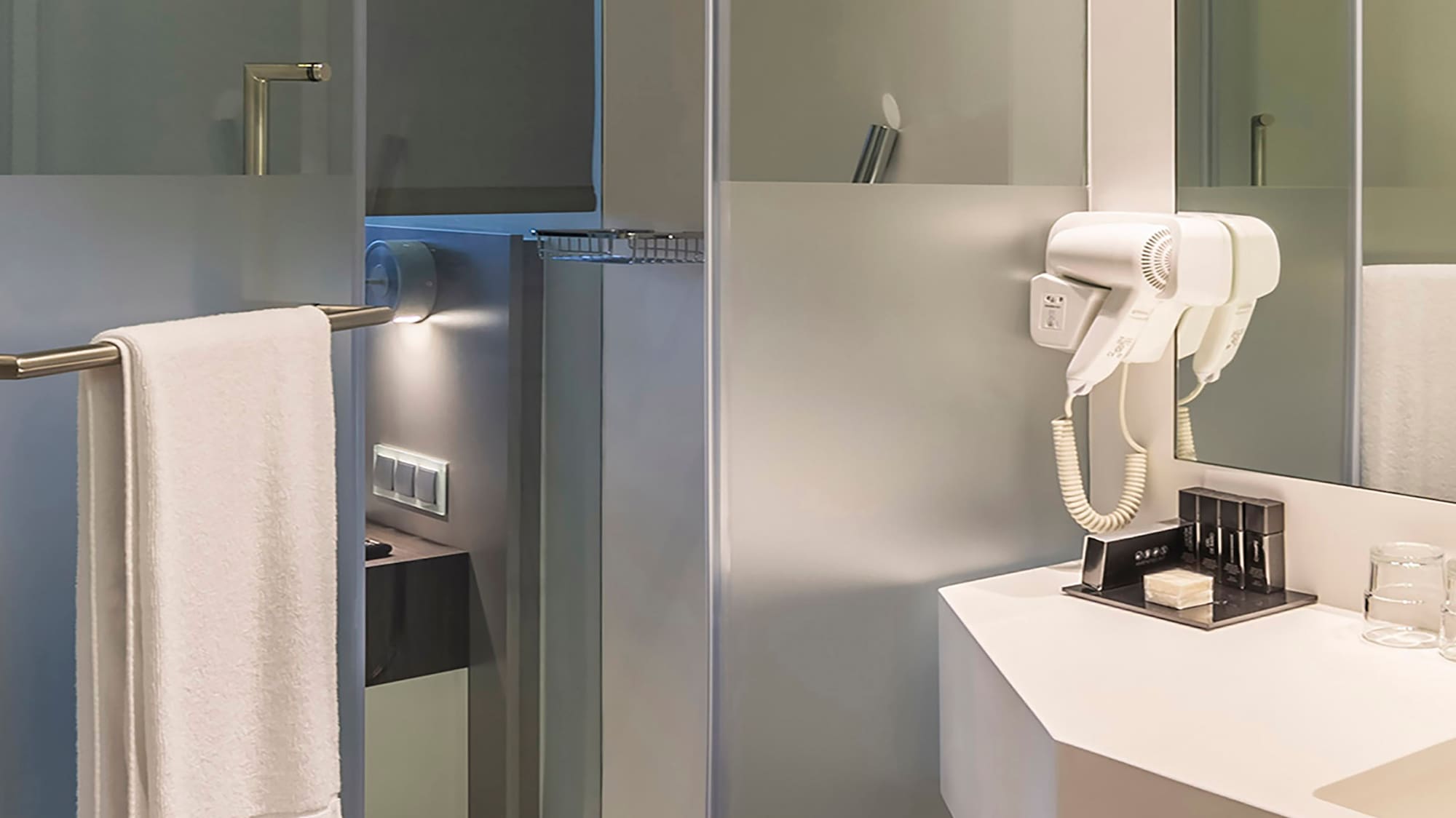 a bathroom with a white towel on a bar