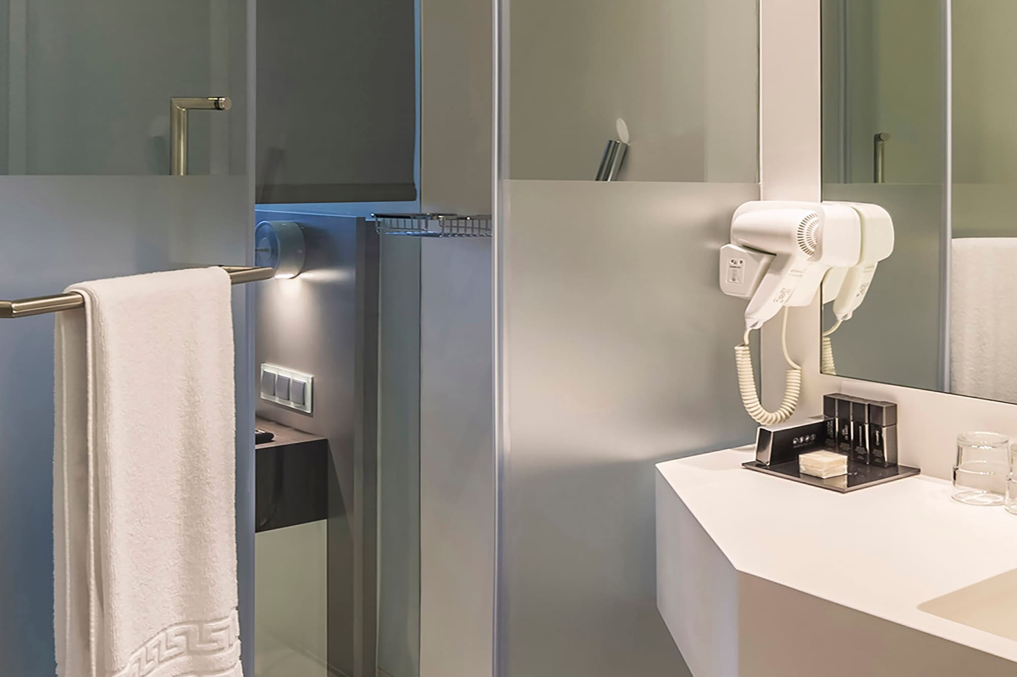 a bathroom with a white towel on a bar