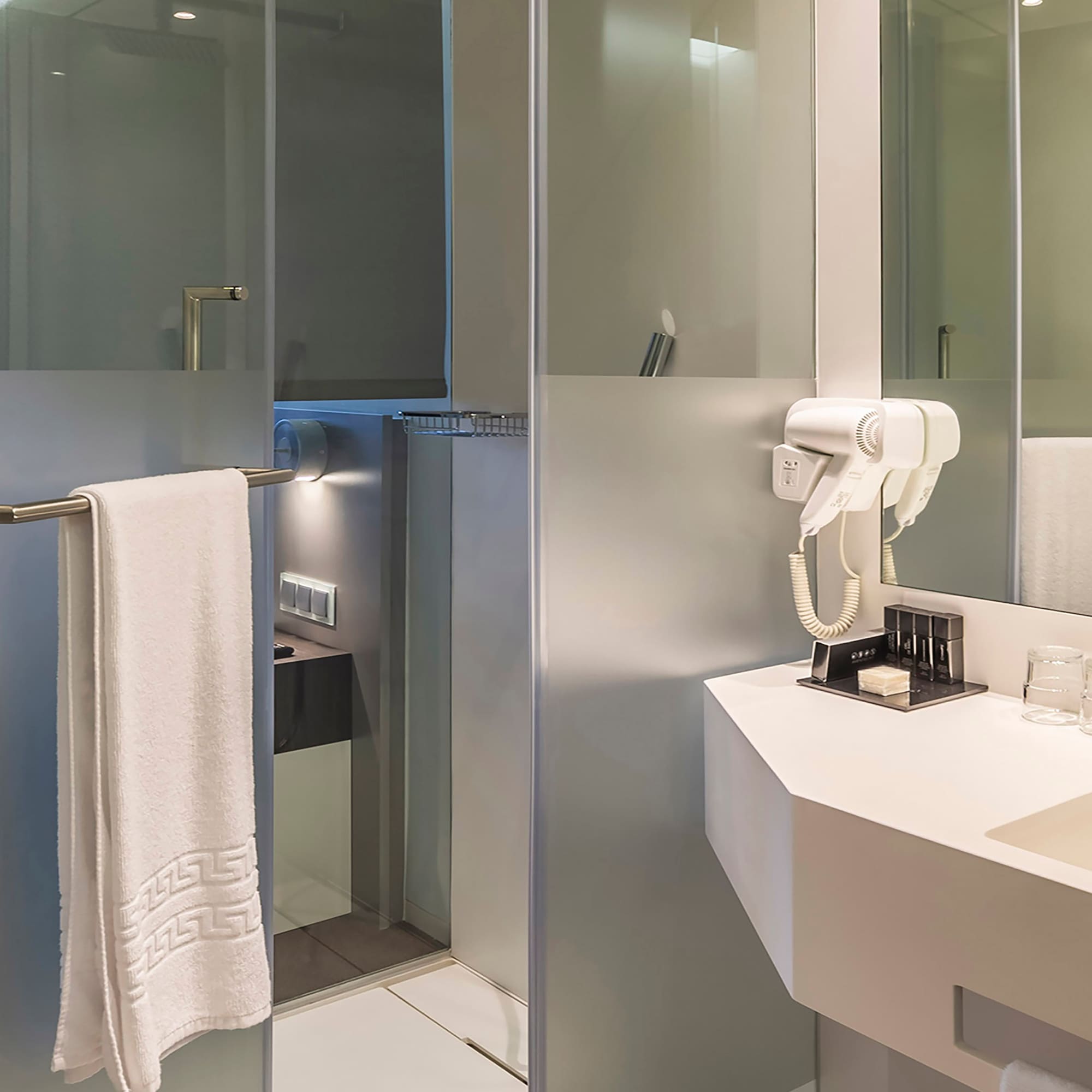 a bathroom with a white towel on a bar