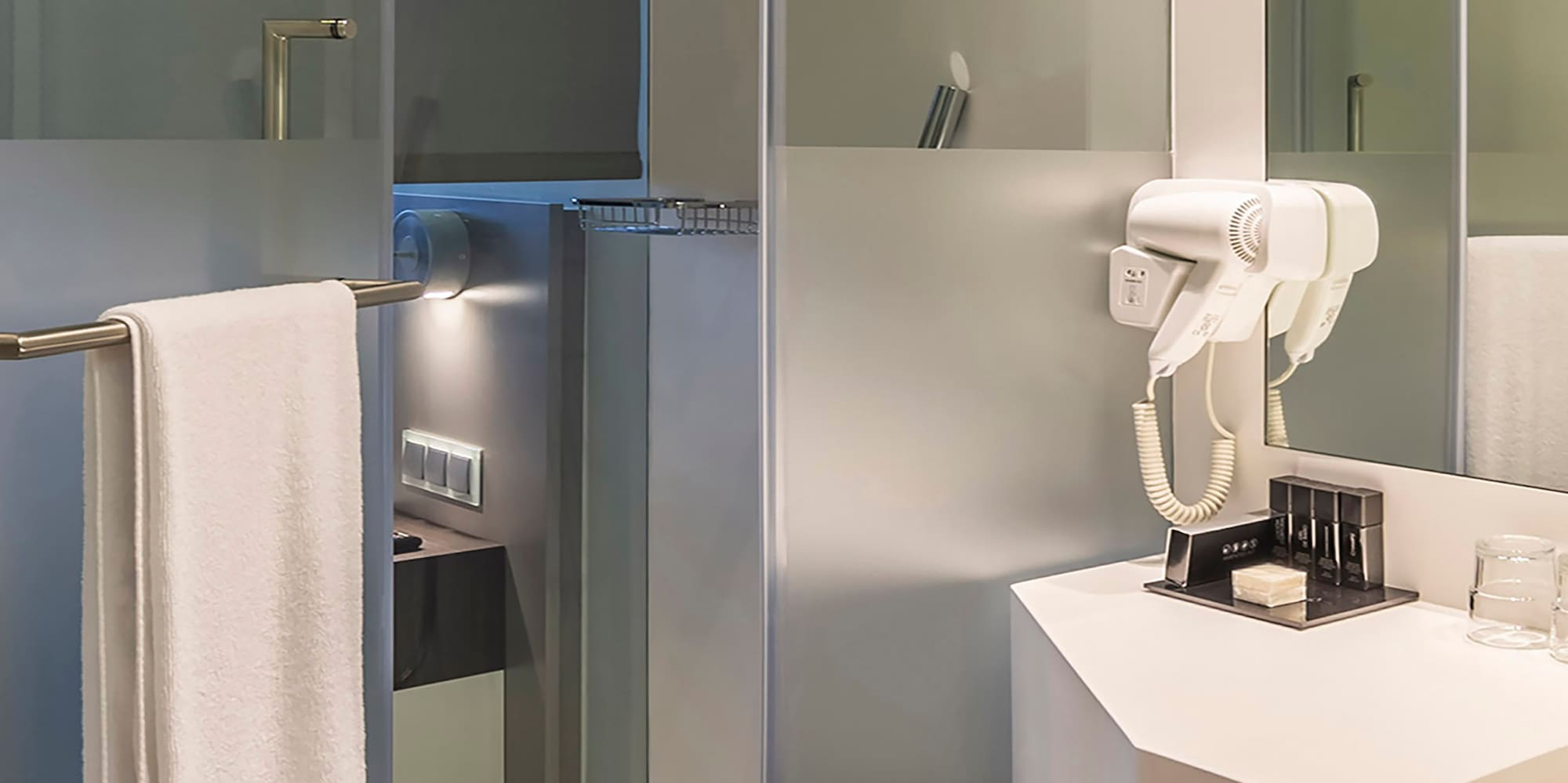 a bathroom with a white towel on a bar