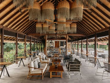 a room with chairs and tables