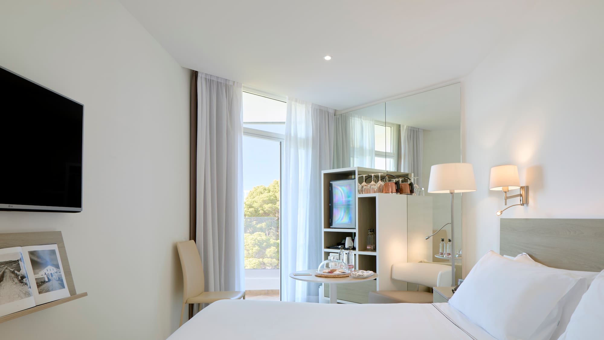 a room with a bed and a mirror