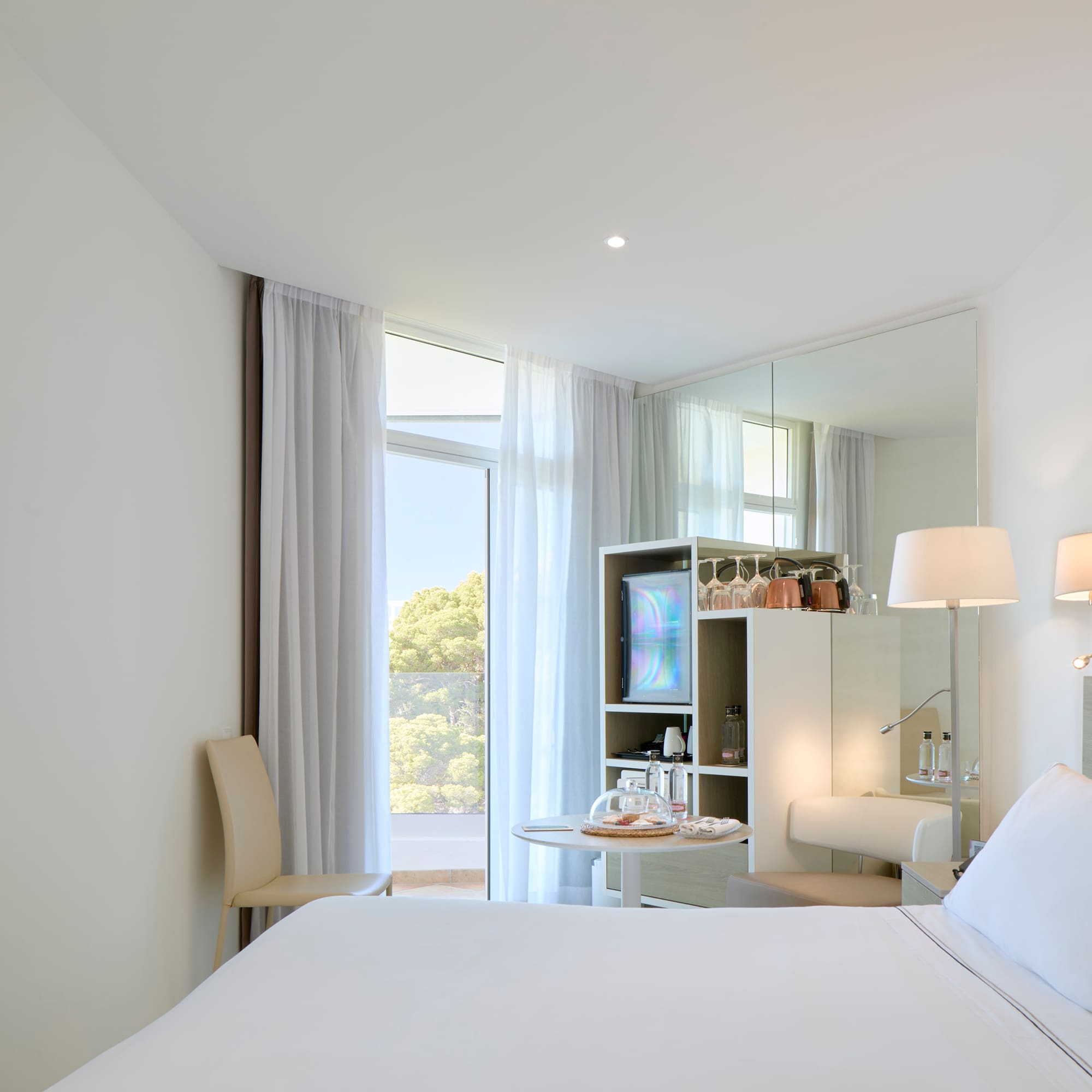 a room with a bed and a mirror