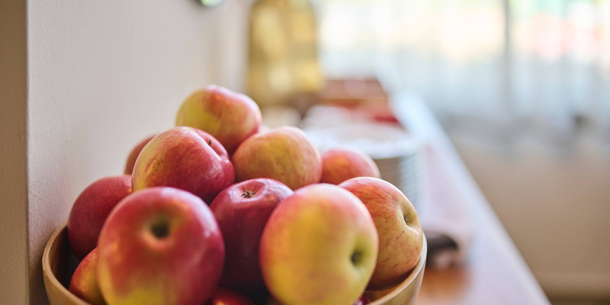 a bowl of apples on a table