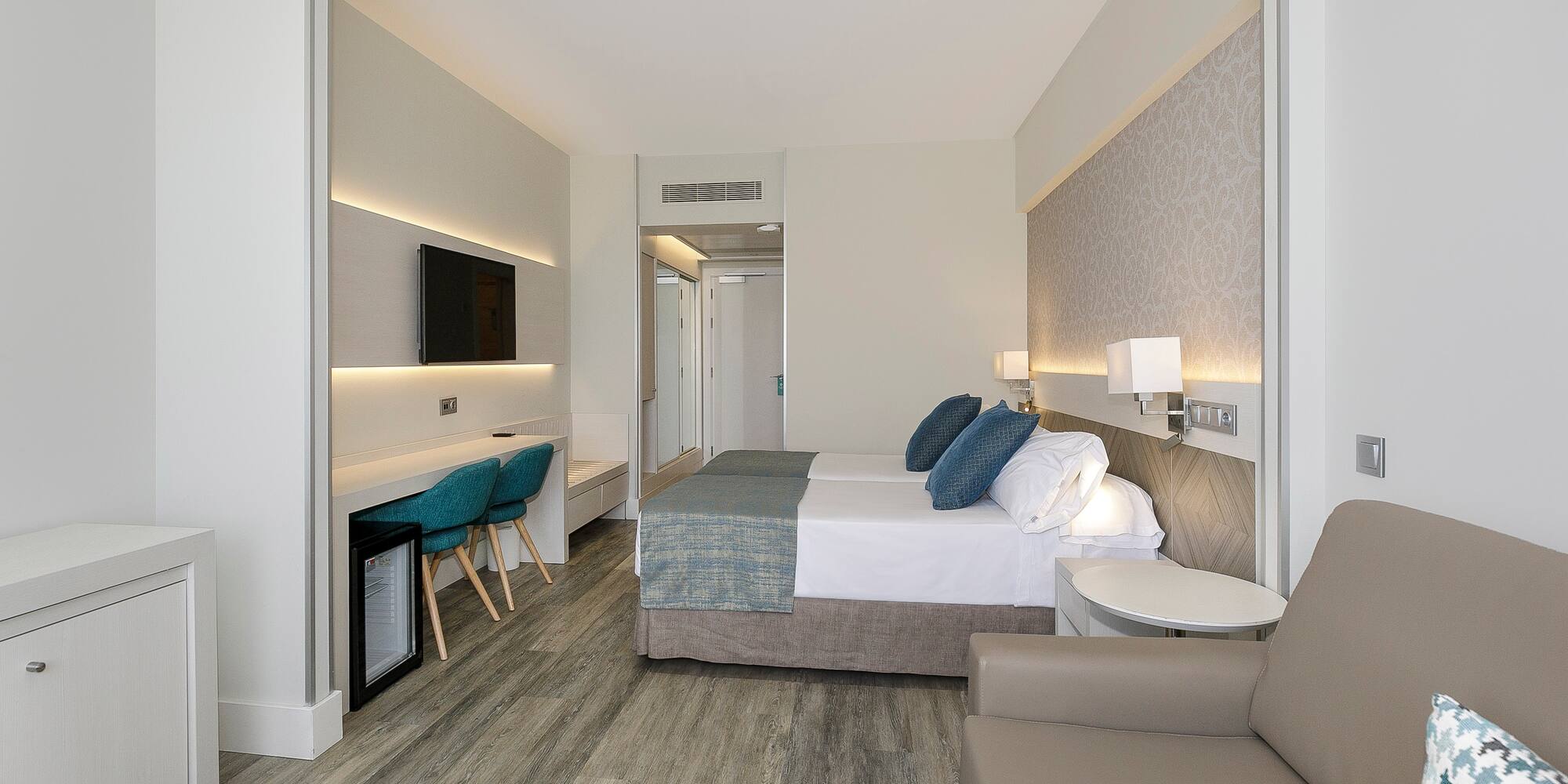 a room with a bed and a tv