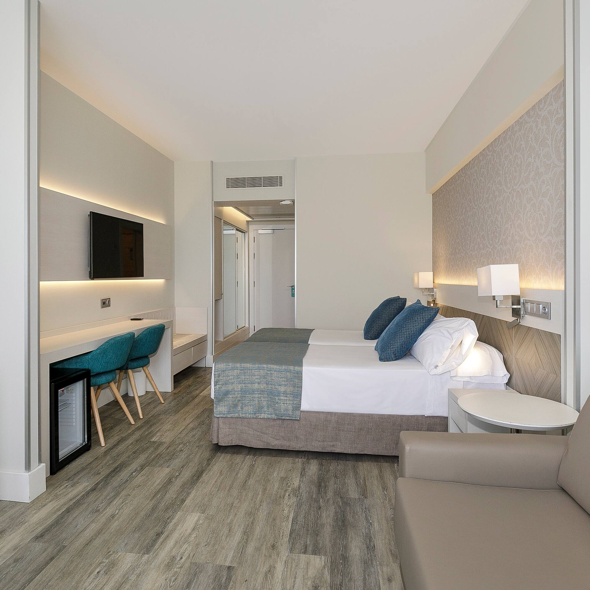 a room with a bed and a tv