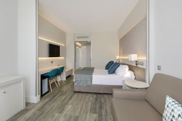 a room with a bed and a tv