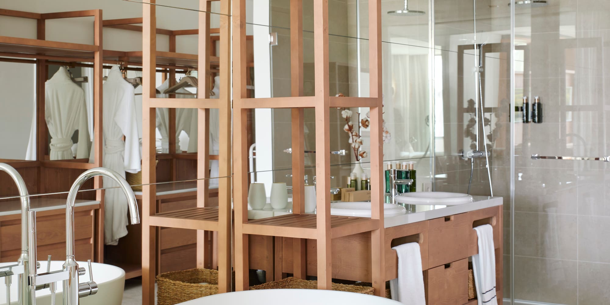 a bathroom with a large mirror and a sink