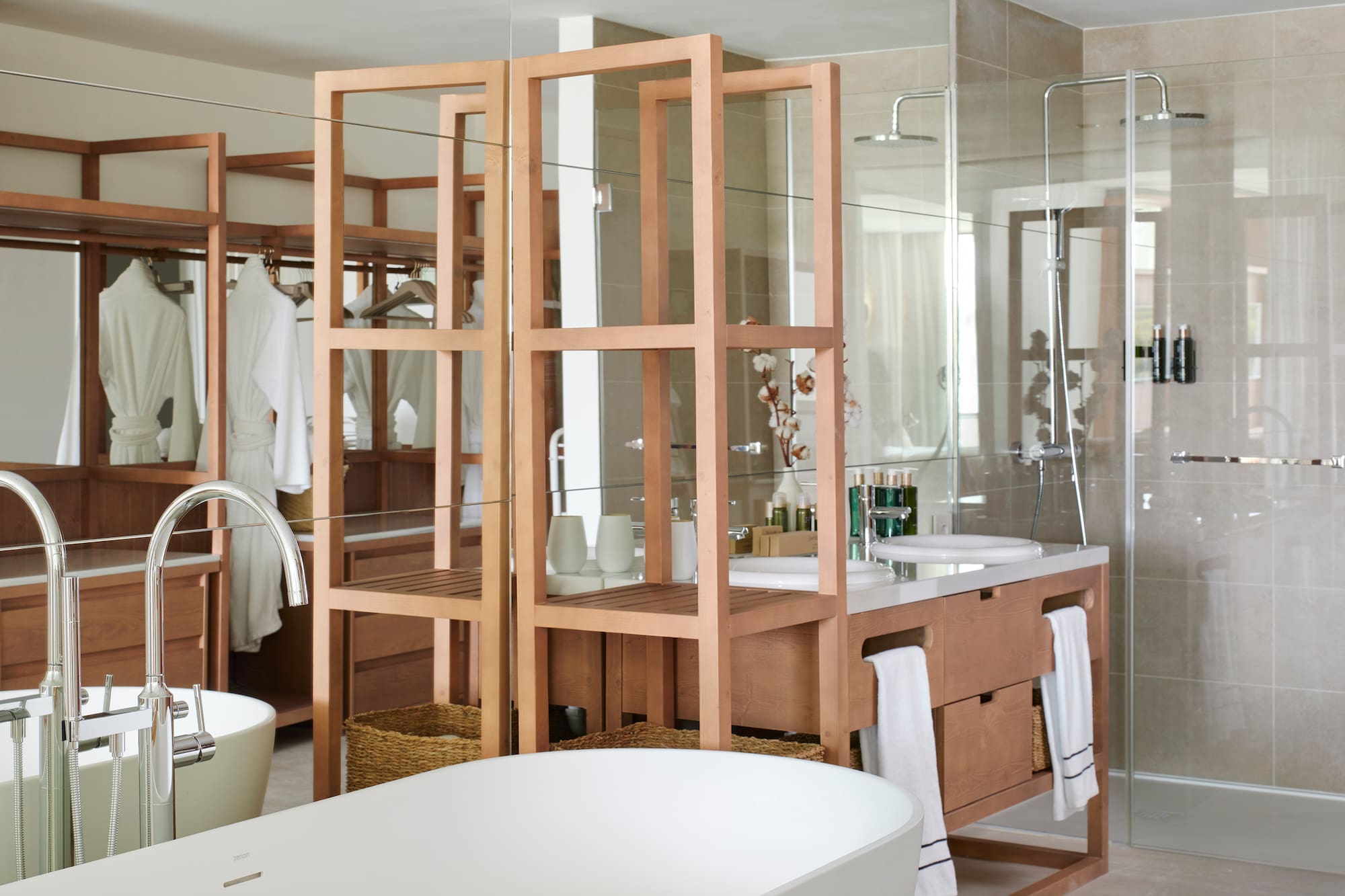 a bathroom with a large mirror and a sink