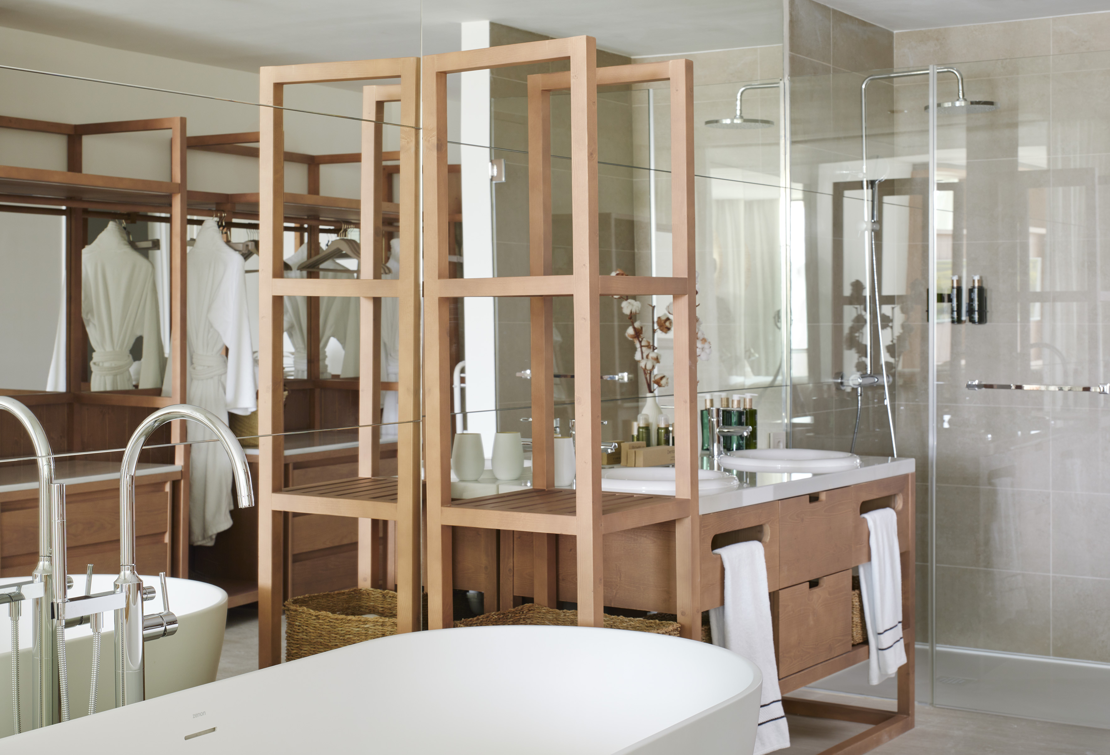 Modern bathroom: freestanding tub, dual vanity, glass shower, wood shelves.