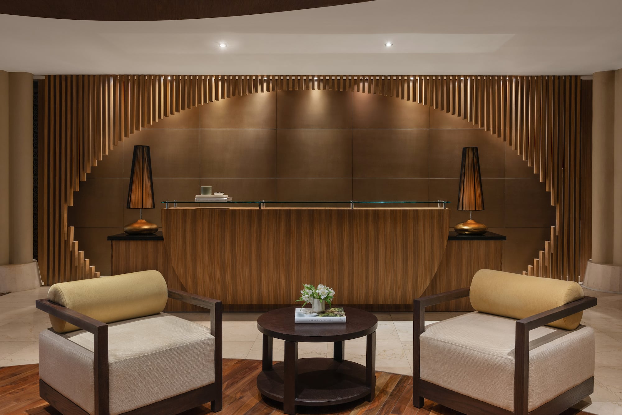 a reception desk with chairs and a table