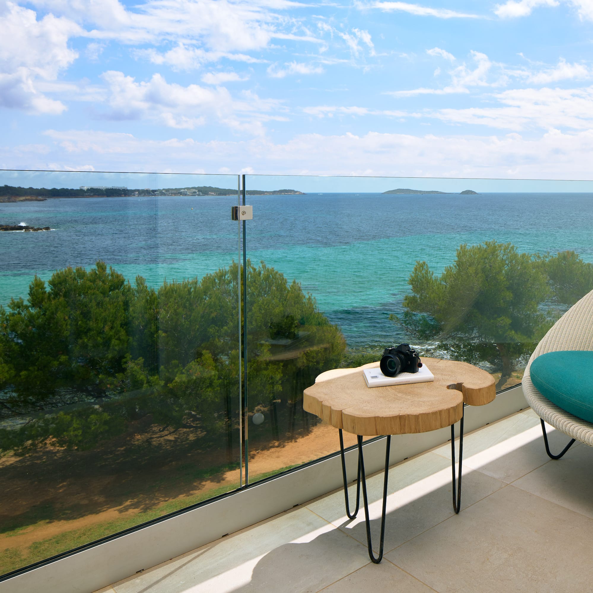 a table with a camera on it overlooking a body of water