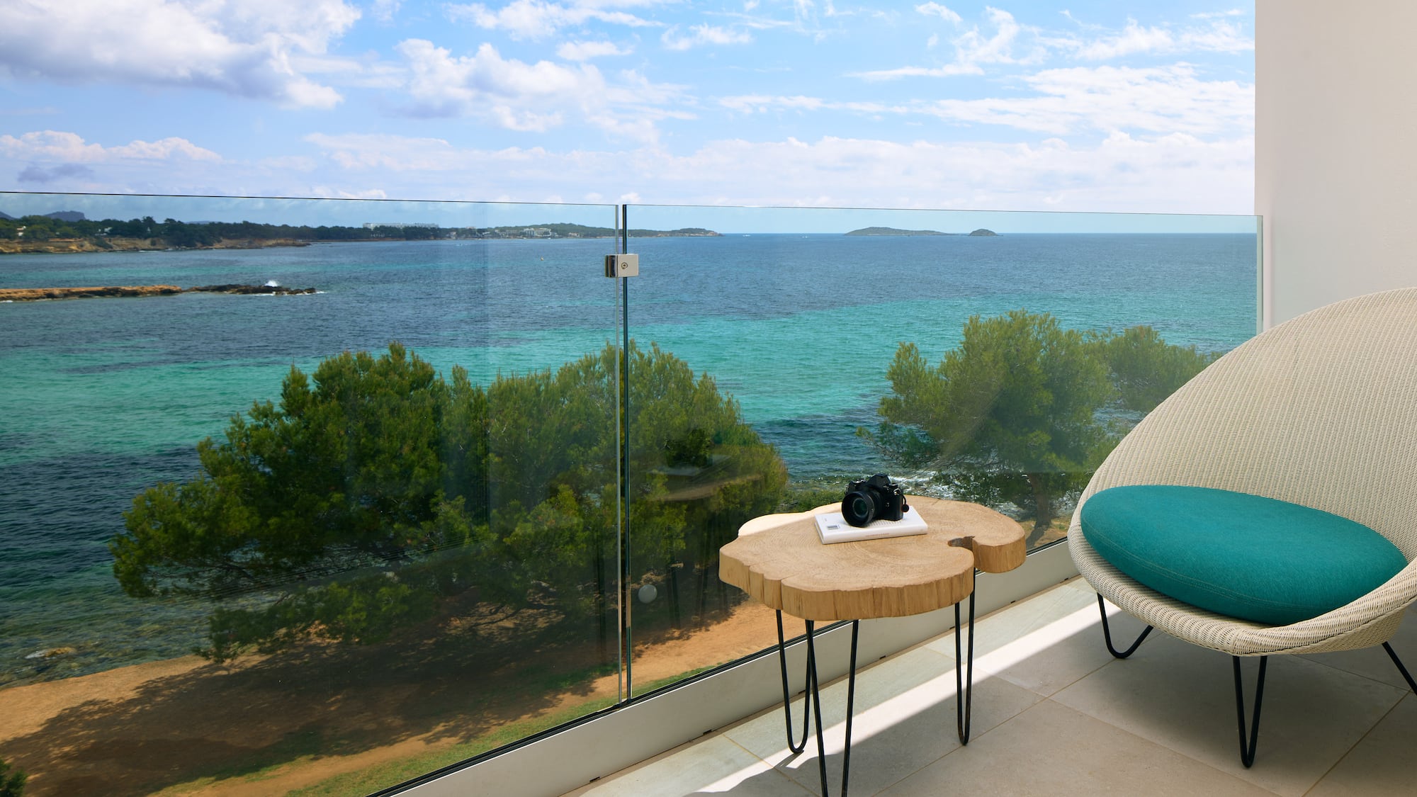 a table with a camera on it overlooking a body of water
