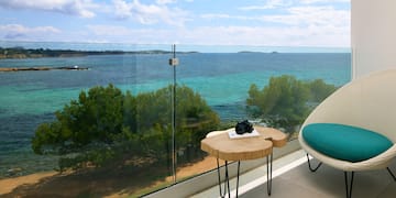 a table with a camera on it overlooking a body of water