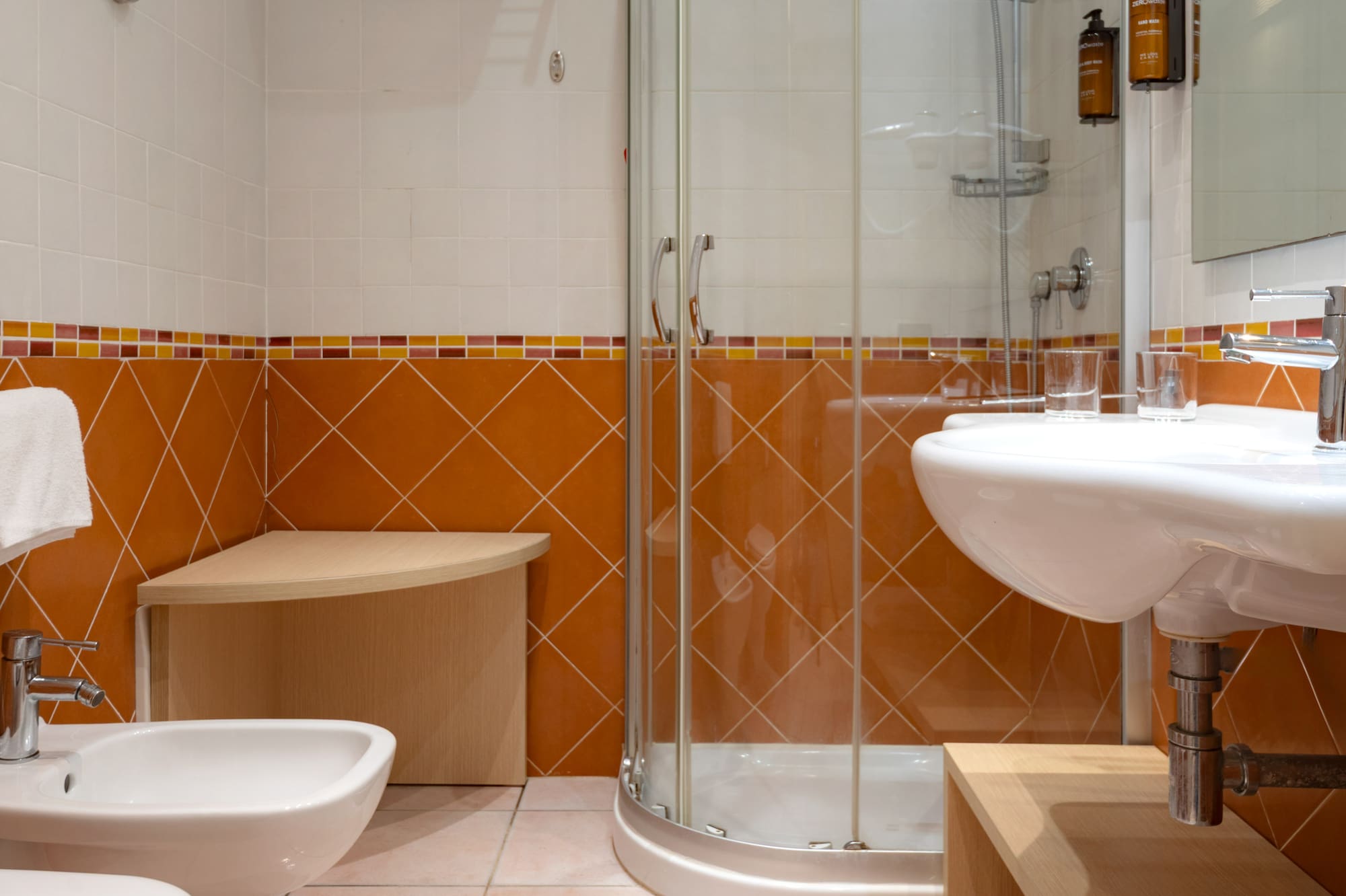 a bathroom with a shower and sink