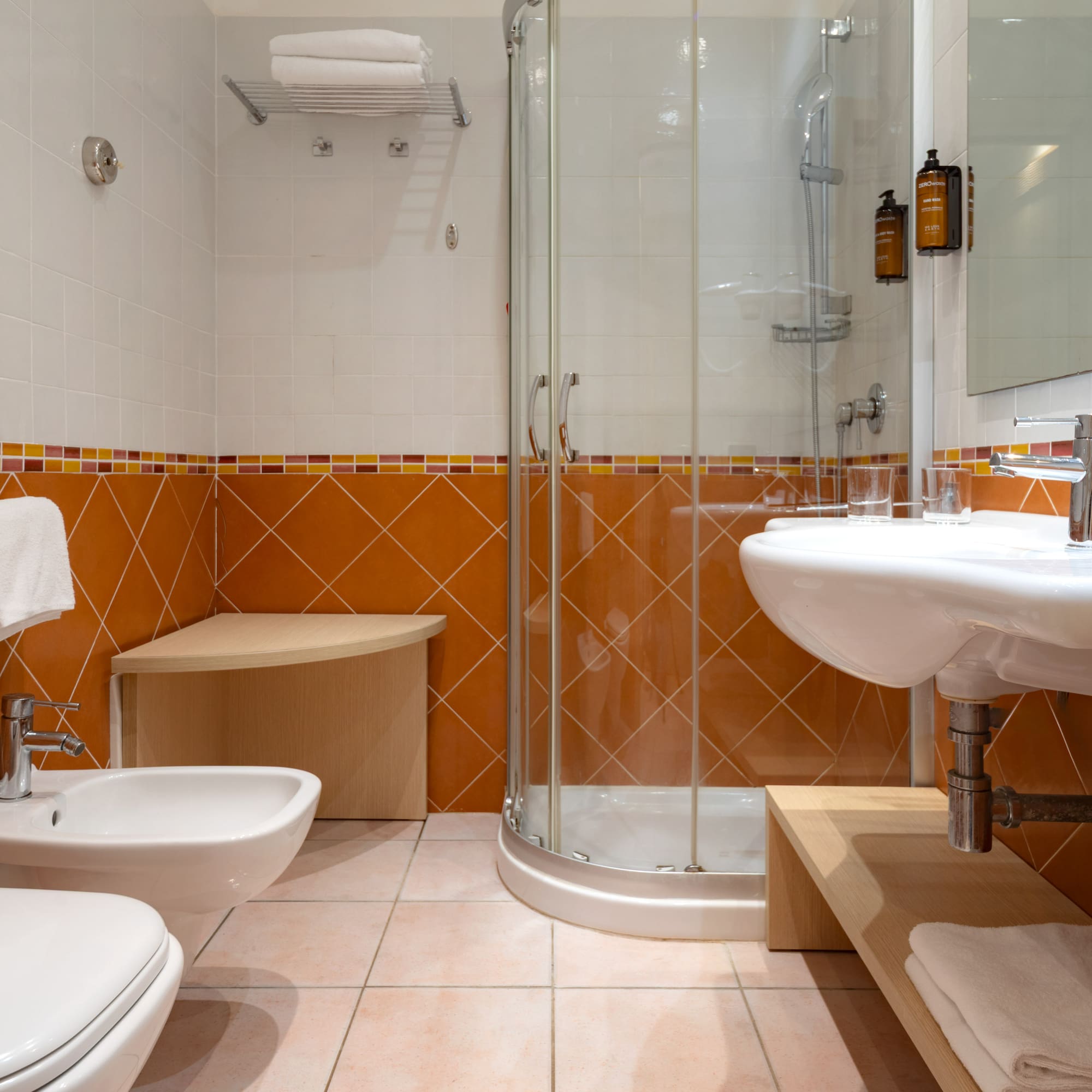 a bathroom with a shower and sink