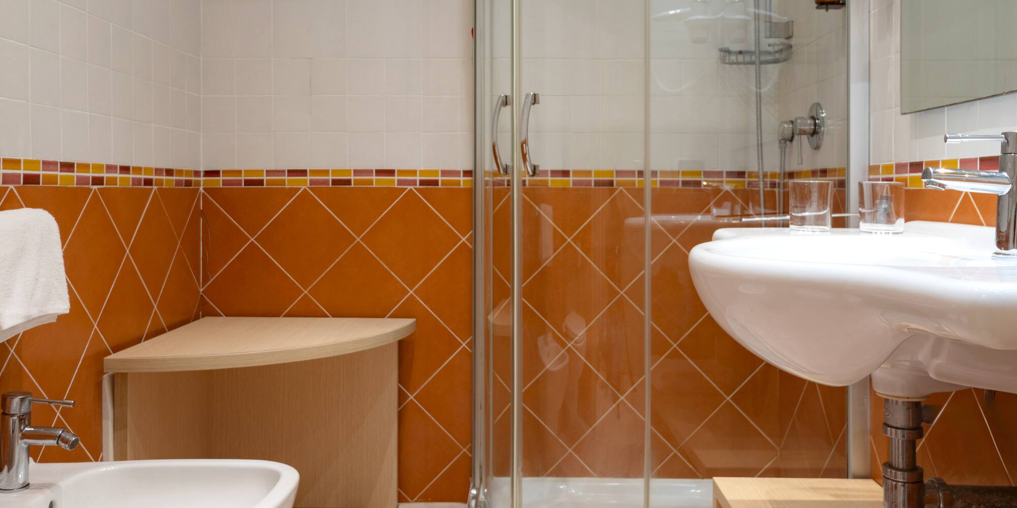 a bathroom with a shower and sink