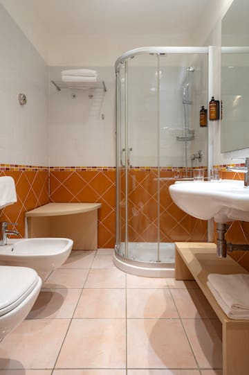 a bathroom with a shower and sink