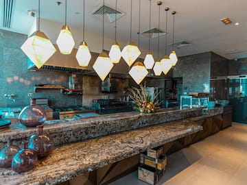 a kitchen with a counter and lights