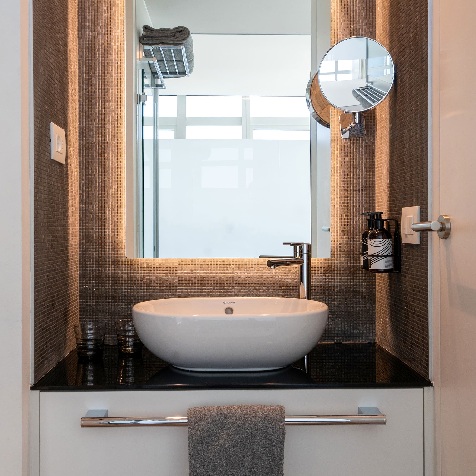 a bathroom with a sink and mirror