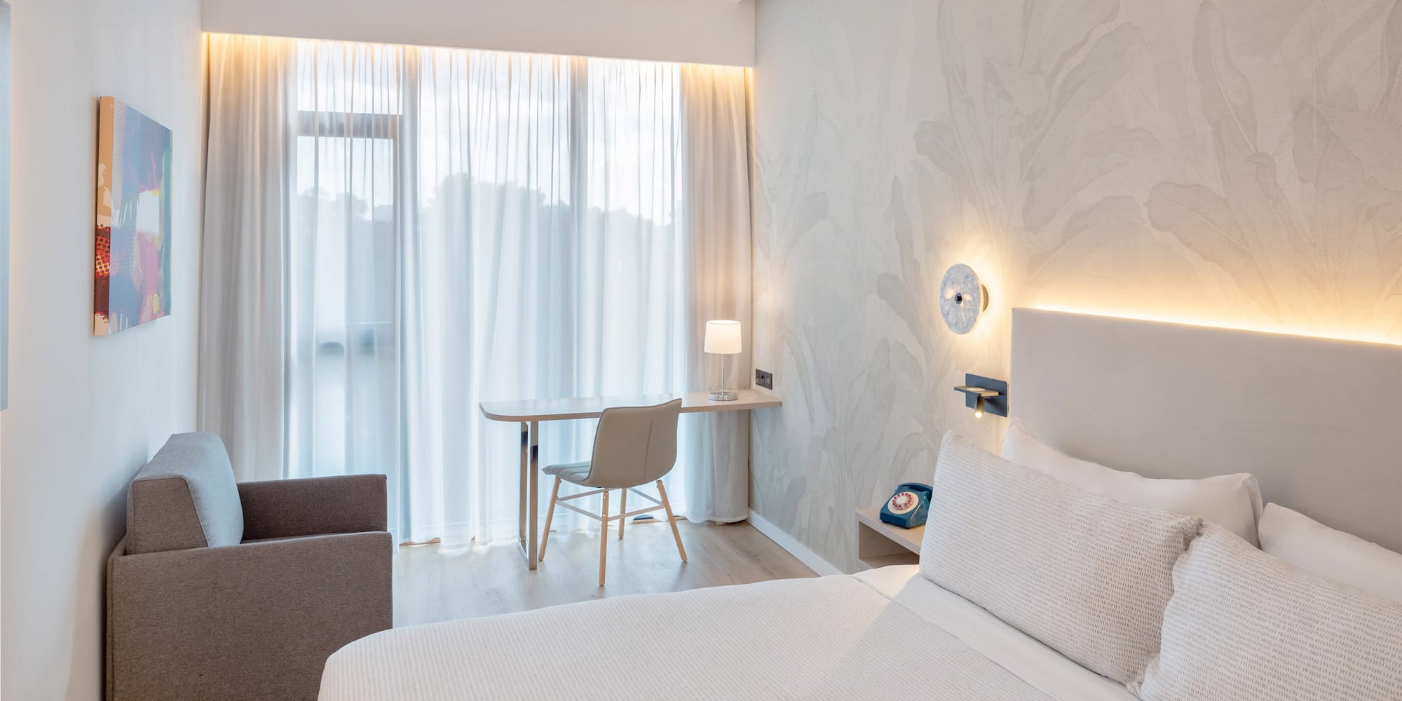 a bedroom with a bed and a desk