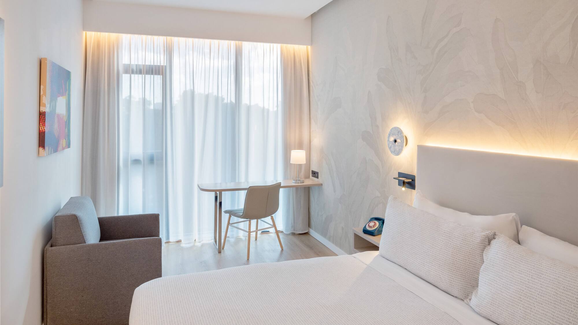 a bedroom with a bed and a desk