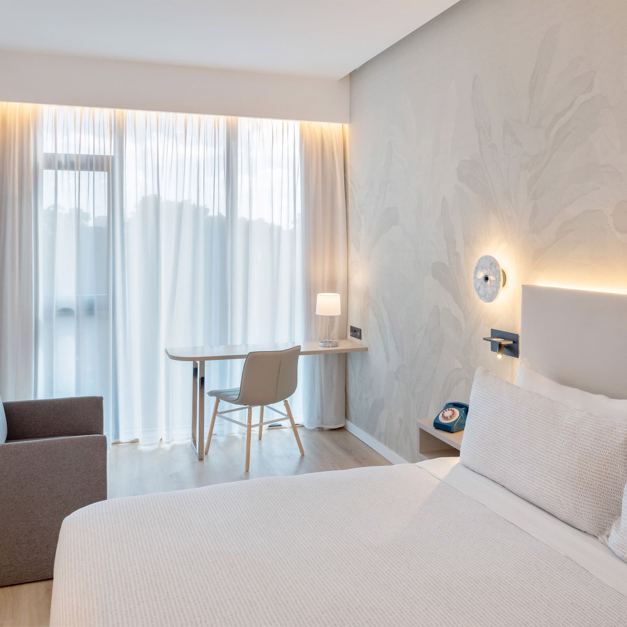 a bedroom with a bed and a desk