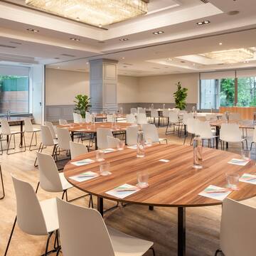 a room with tables and chairs