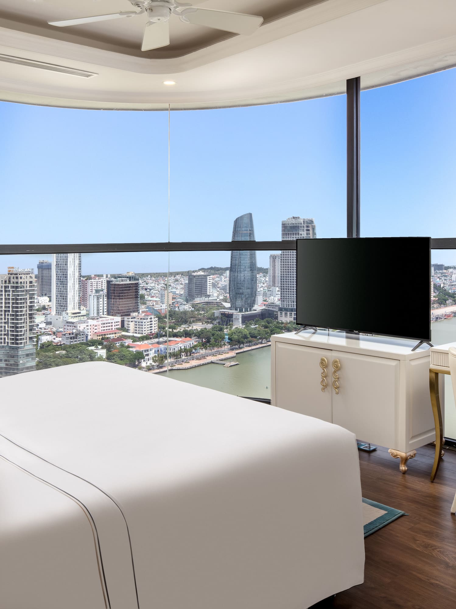 a room with a large window overlooking a city