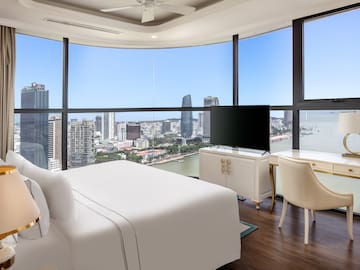 a room with a large window overlooking a city
