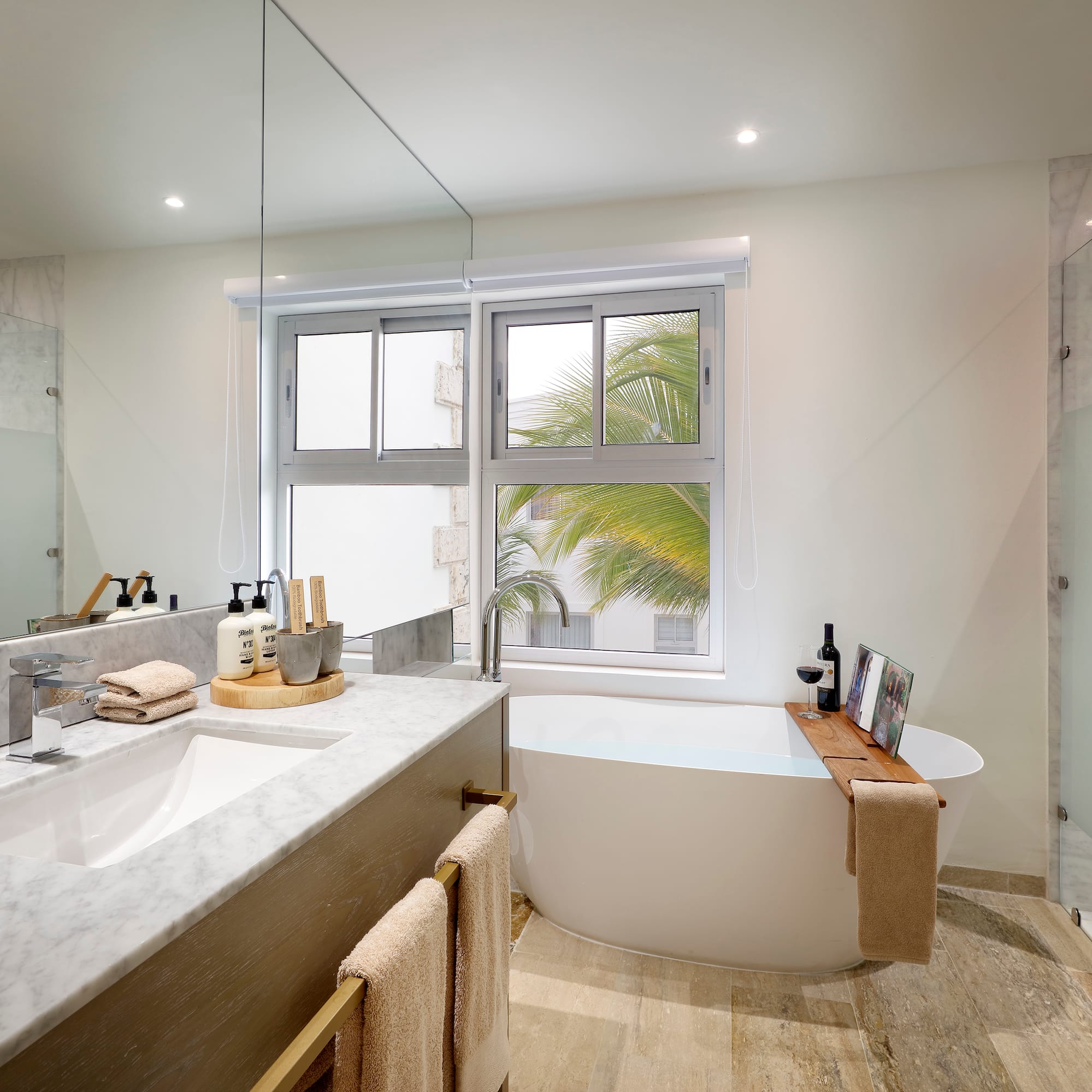 a bathroom with a large window and a tub