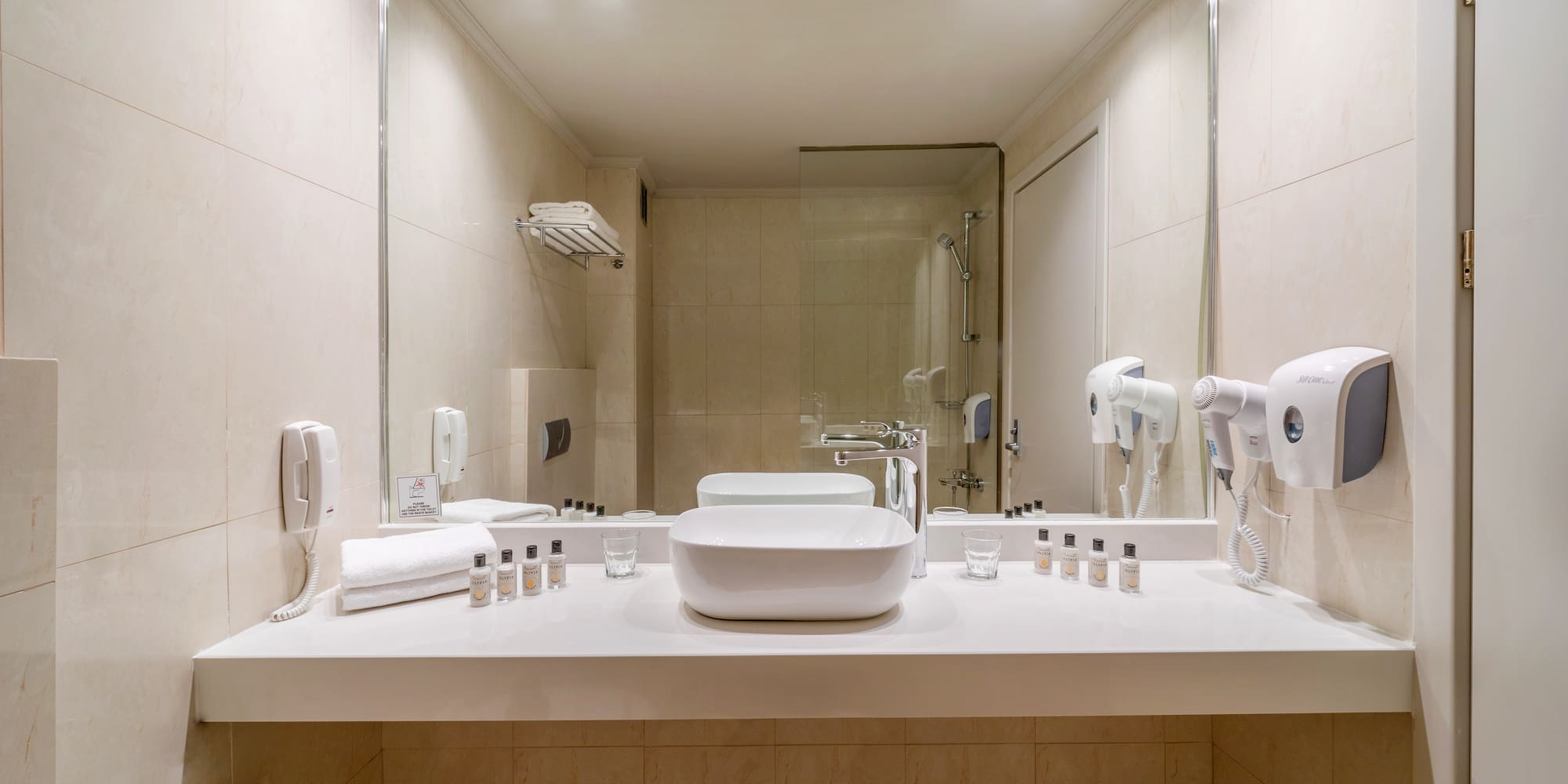 a bathroom with a mirror and sink