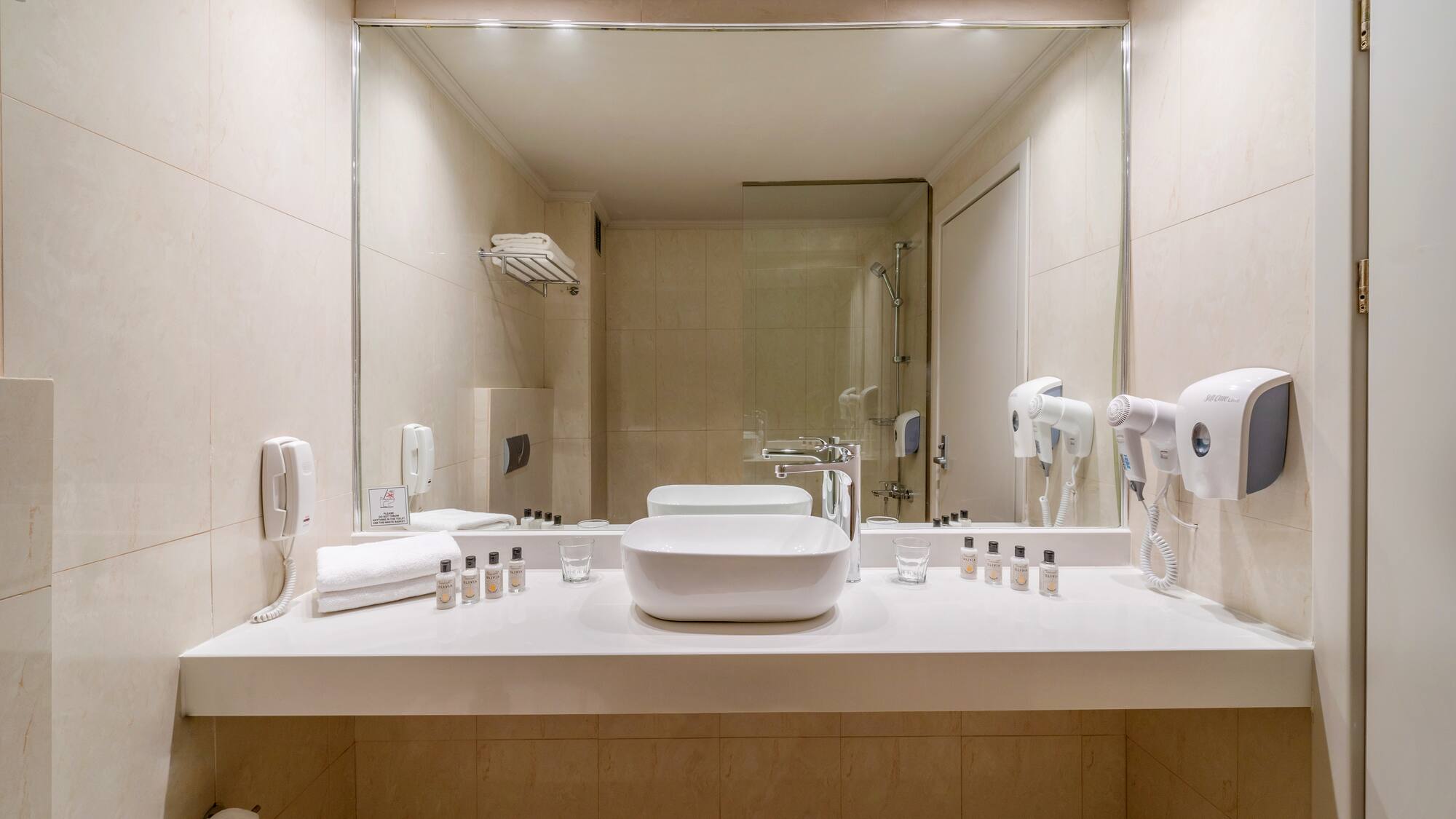 a bathroom with a mirror and sink