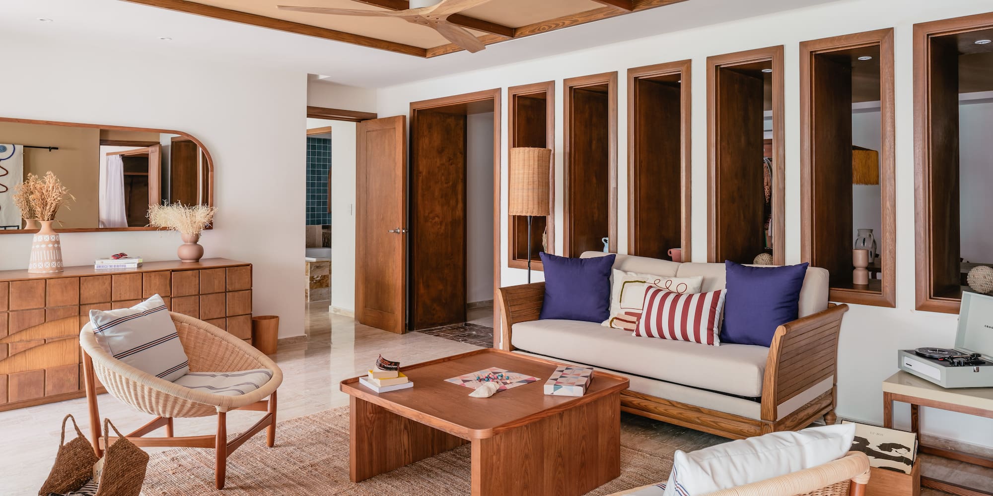 a living room with a couch and chairs