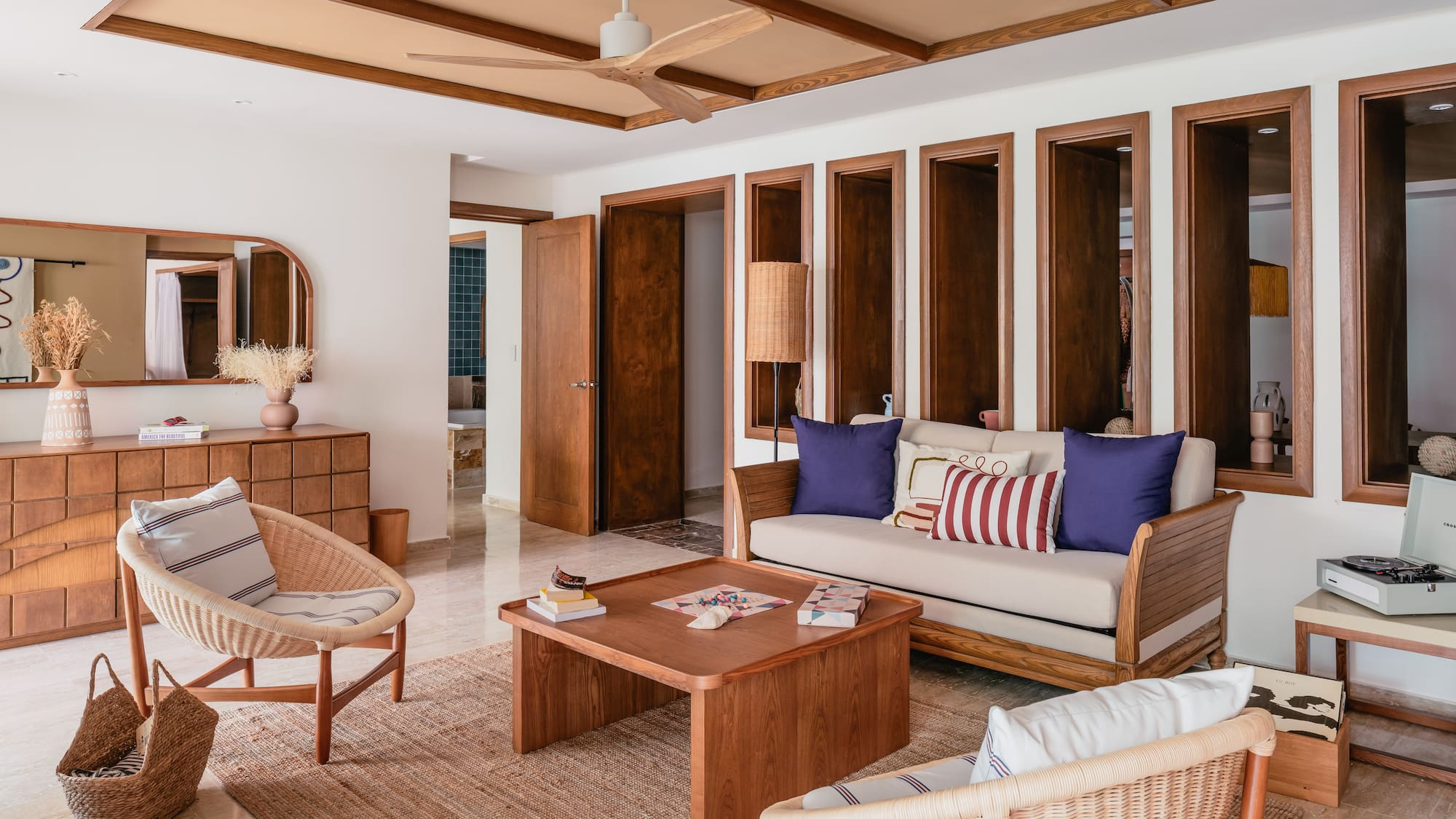 a living room with a couch and chairs