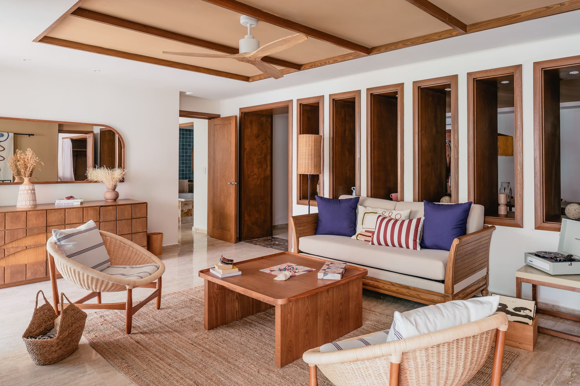 a living room with a couch and chairs