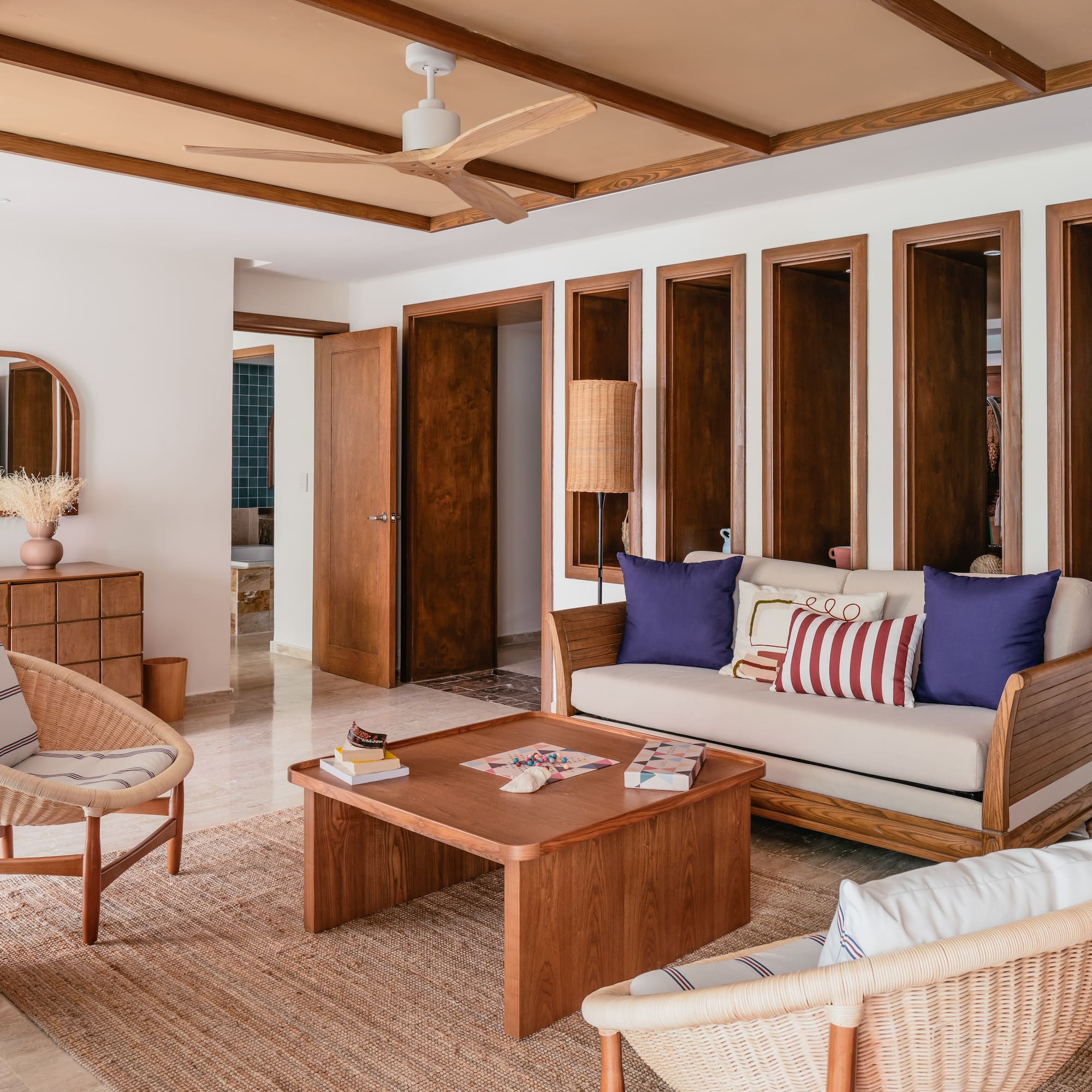 a living room with a couch and chairs