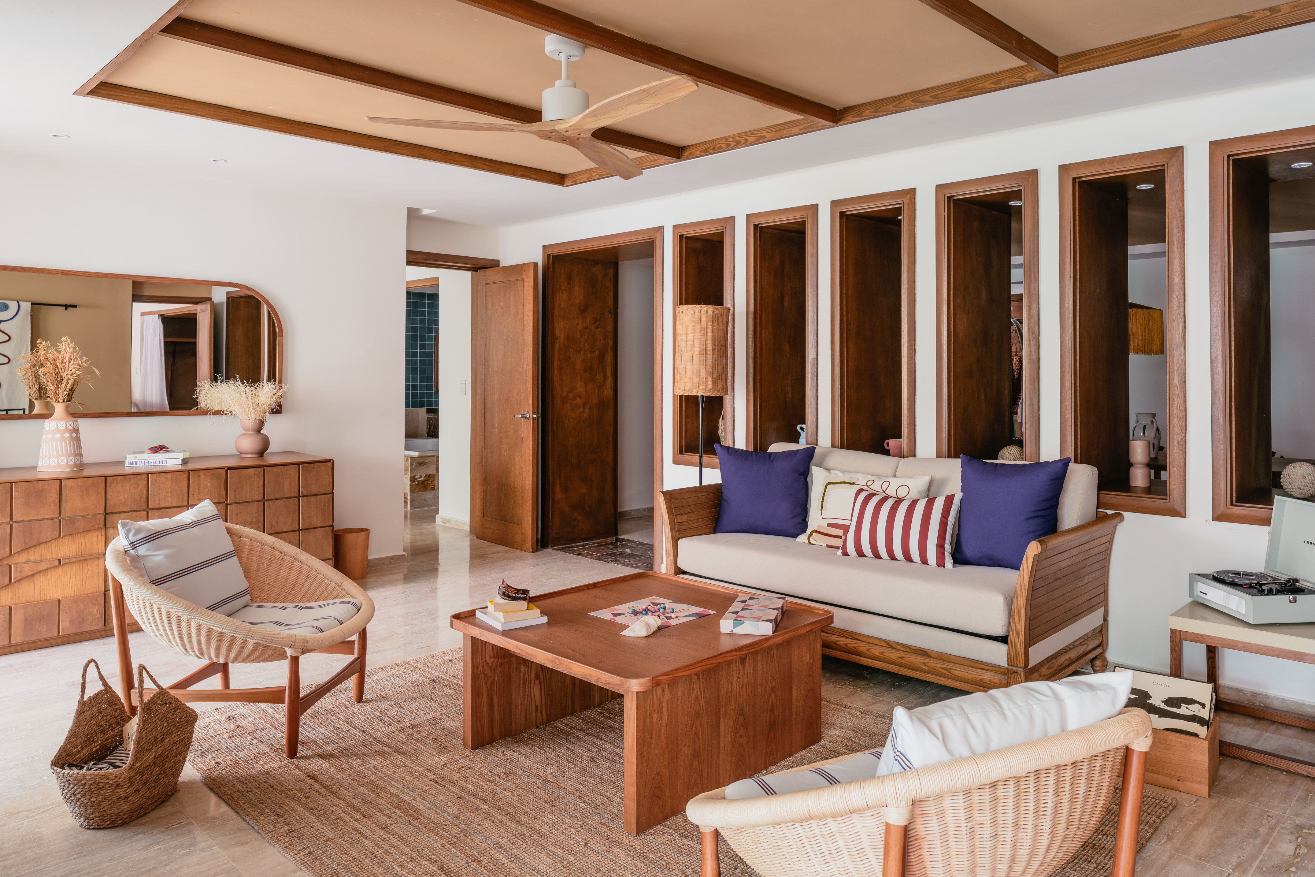 a living room with a couch and chairs