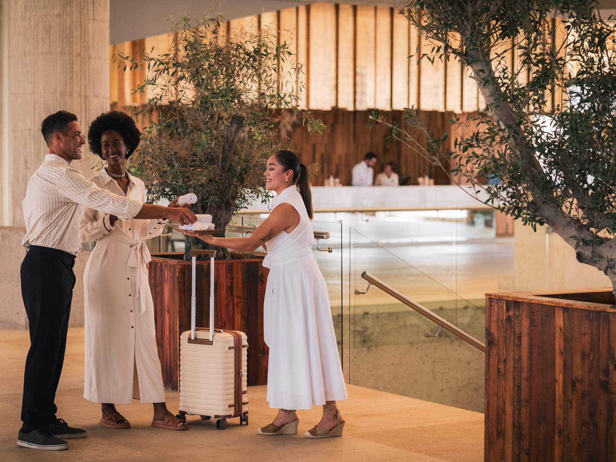 a group of people in white dresses