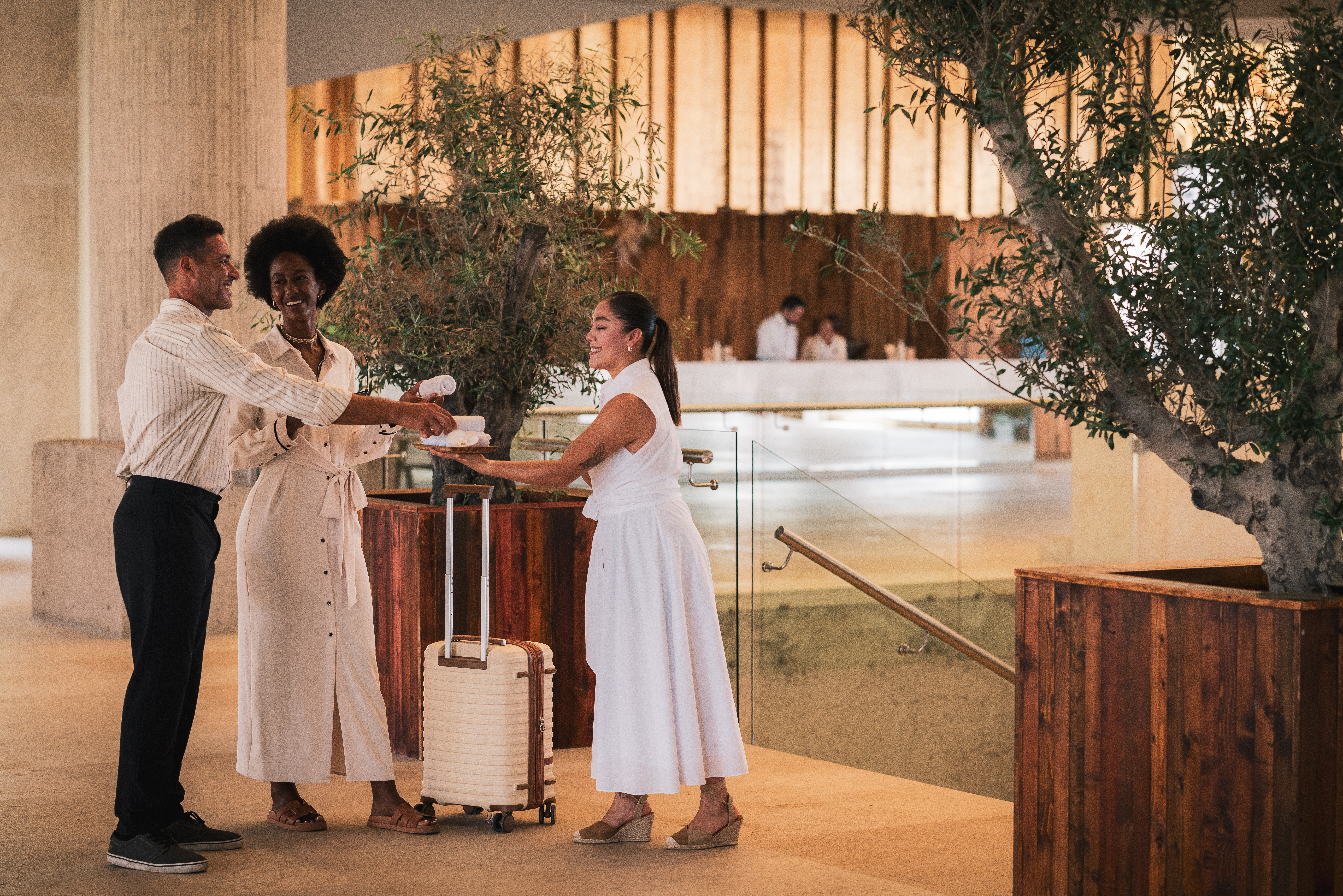 a group of people in white dresses