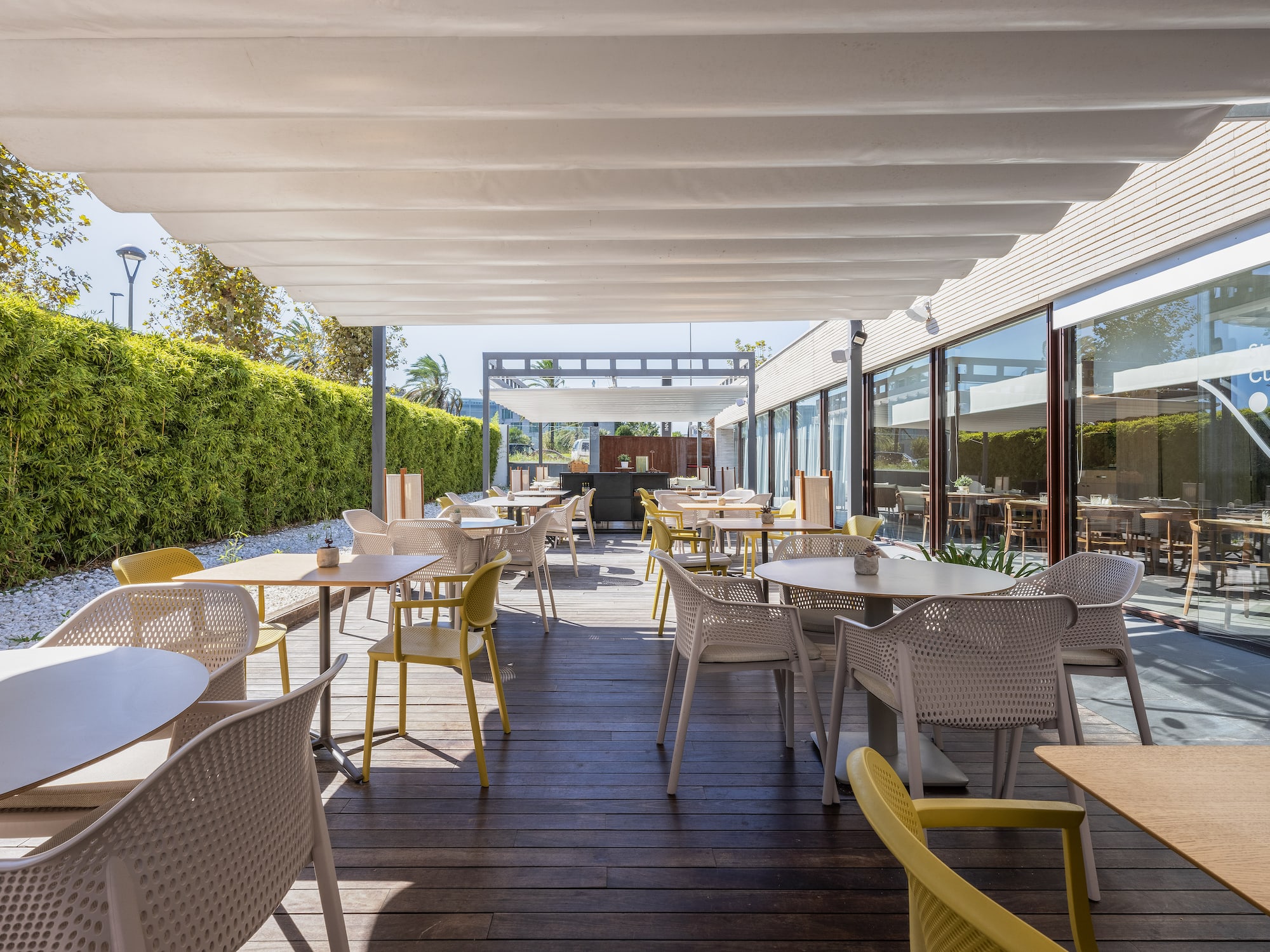 a patio with tables and chairs