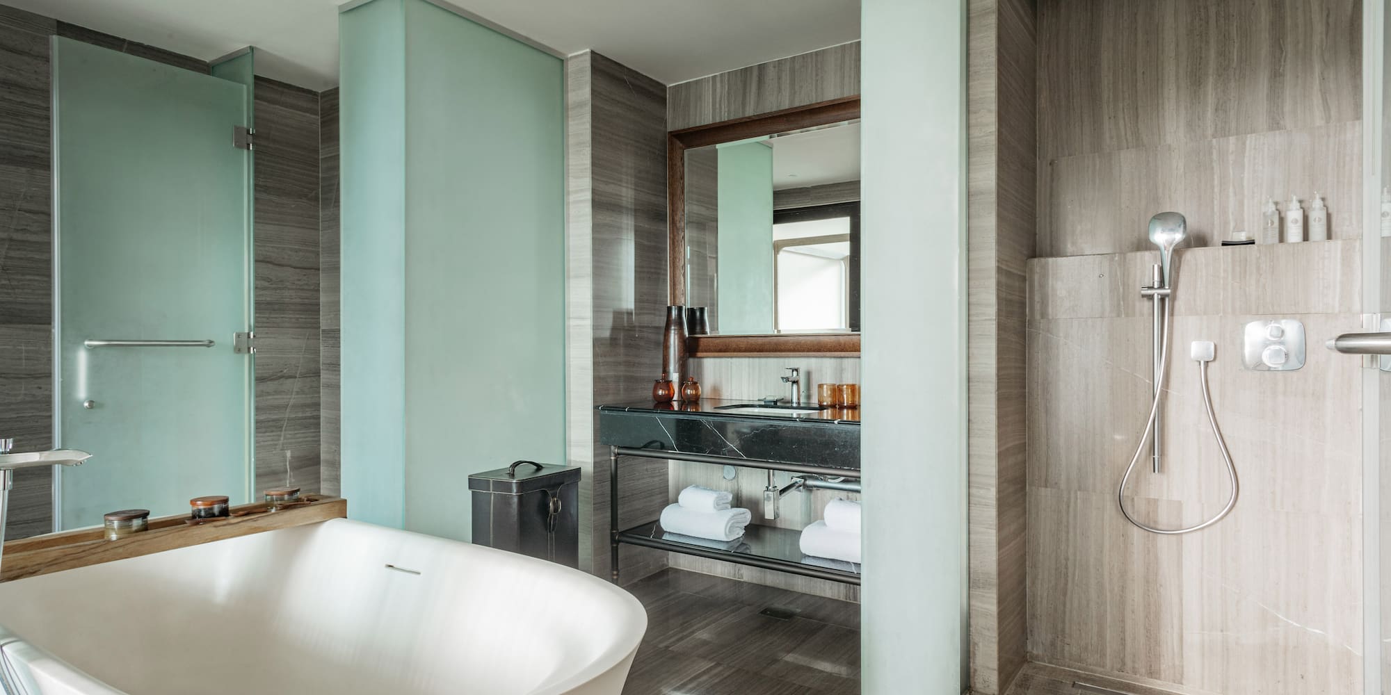 a bathroom with a tub and shower