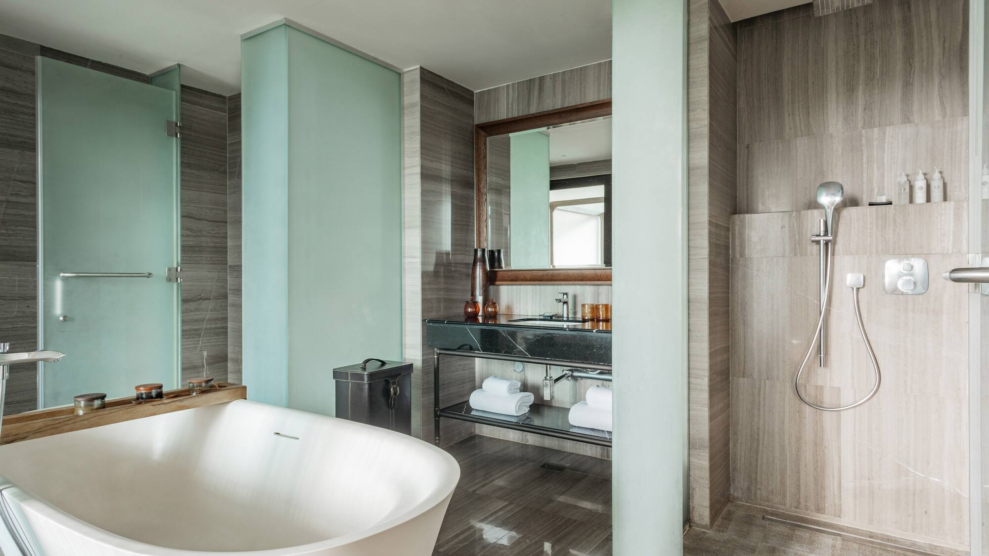 a bathroom with a tub and shower