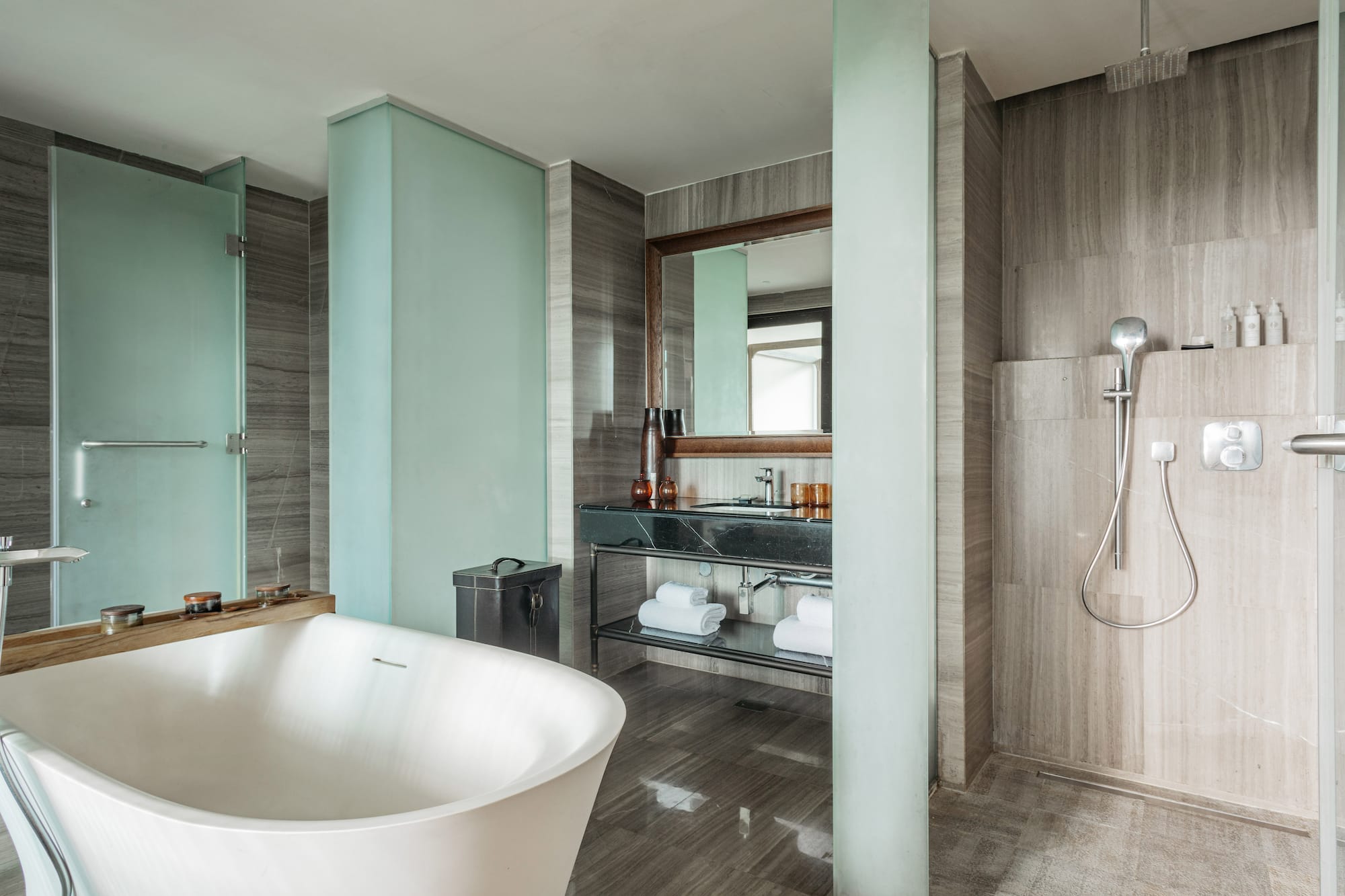 a bathroom with a tub and shower