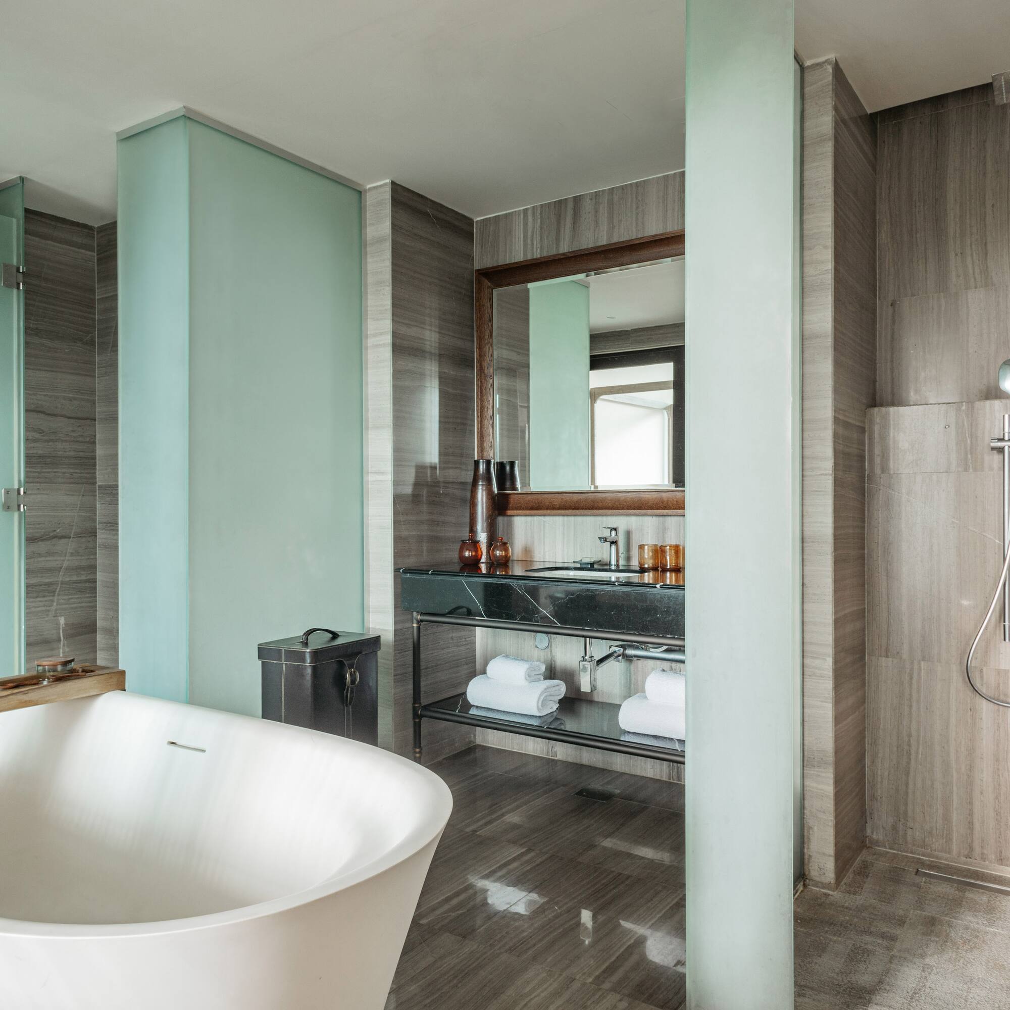 a bathroom with a tub and shower