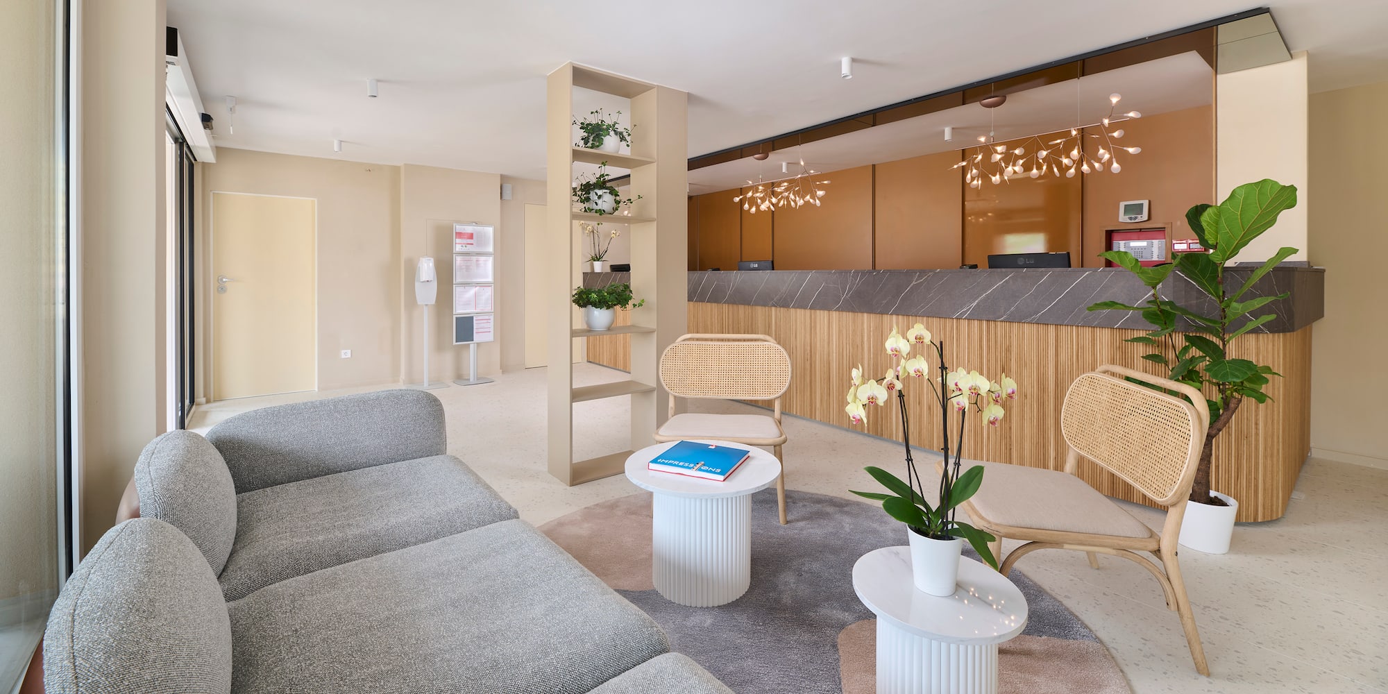 a room with a couch and chairs