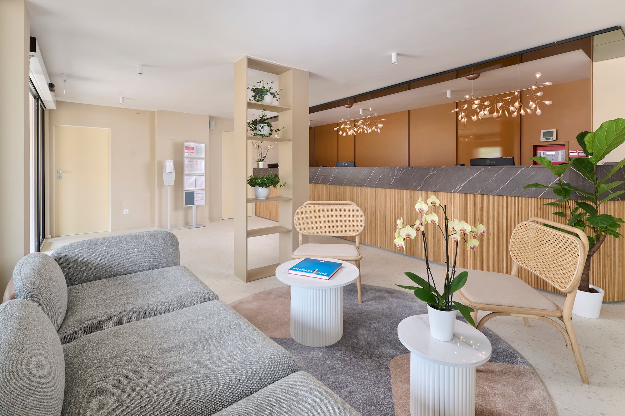 a room with a couch and chairs